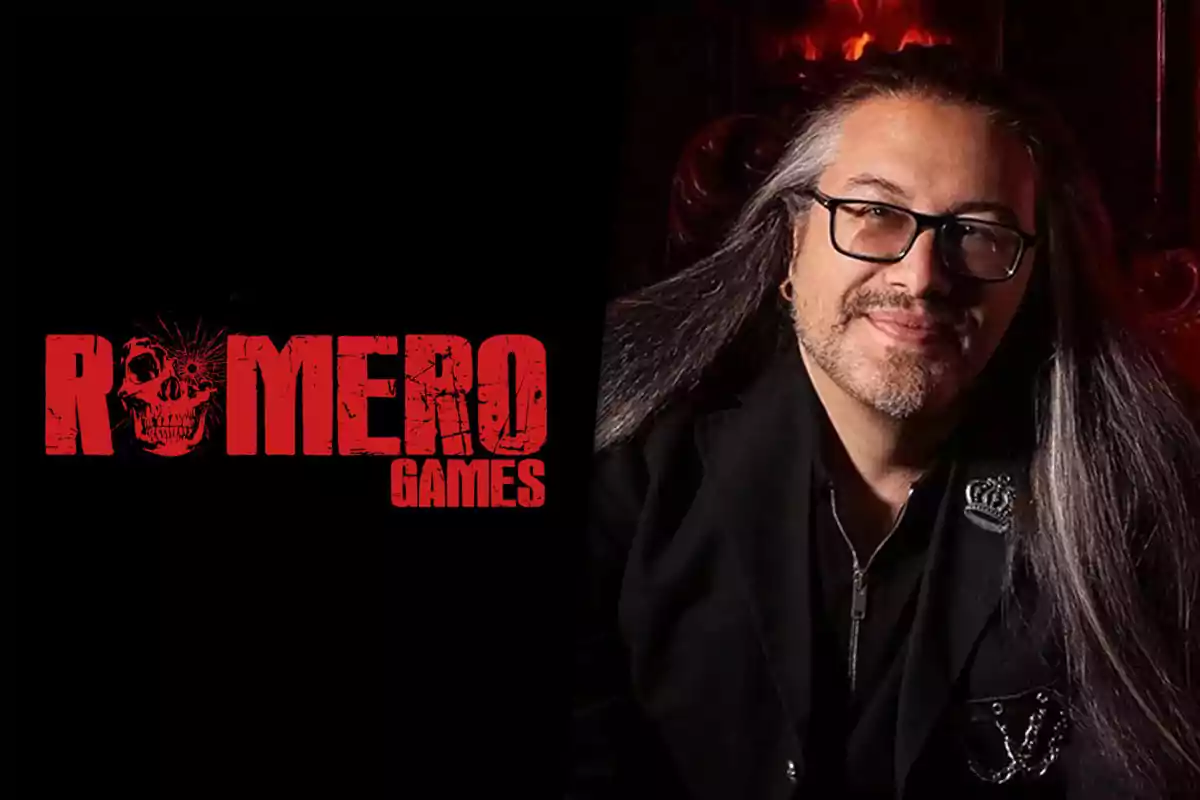 Long-haired man with glasses smiles next to the red Romero Games logo on a black background