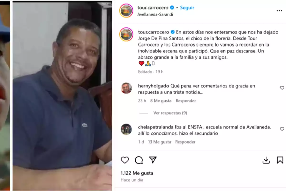 Hombre de mediana edad con barba y bigote sonríe mientras está sentado en una mesa, viste una camisa tipo polo azul y está en un ambiente interior Hombre de mediana edad con barba y bigote sonríe mientras está sentado en una mesa, viste una camisa tipo polo azul y está en un ambiente interior