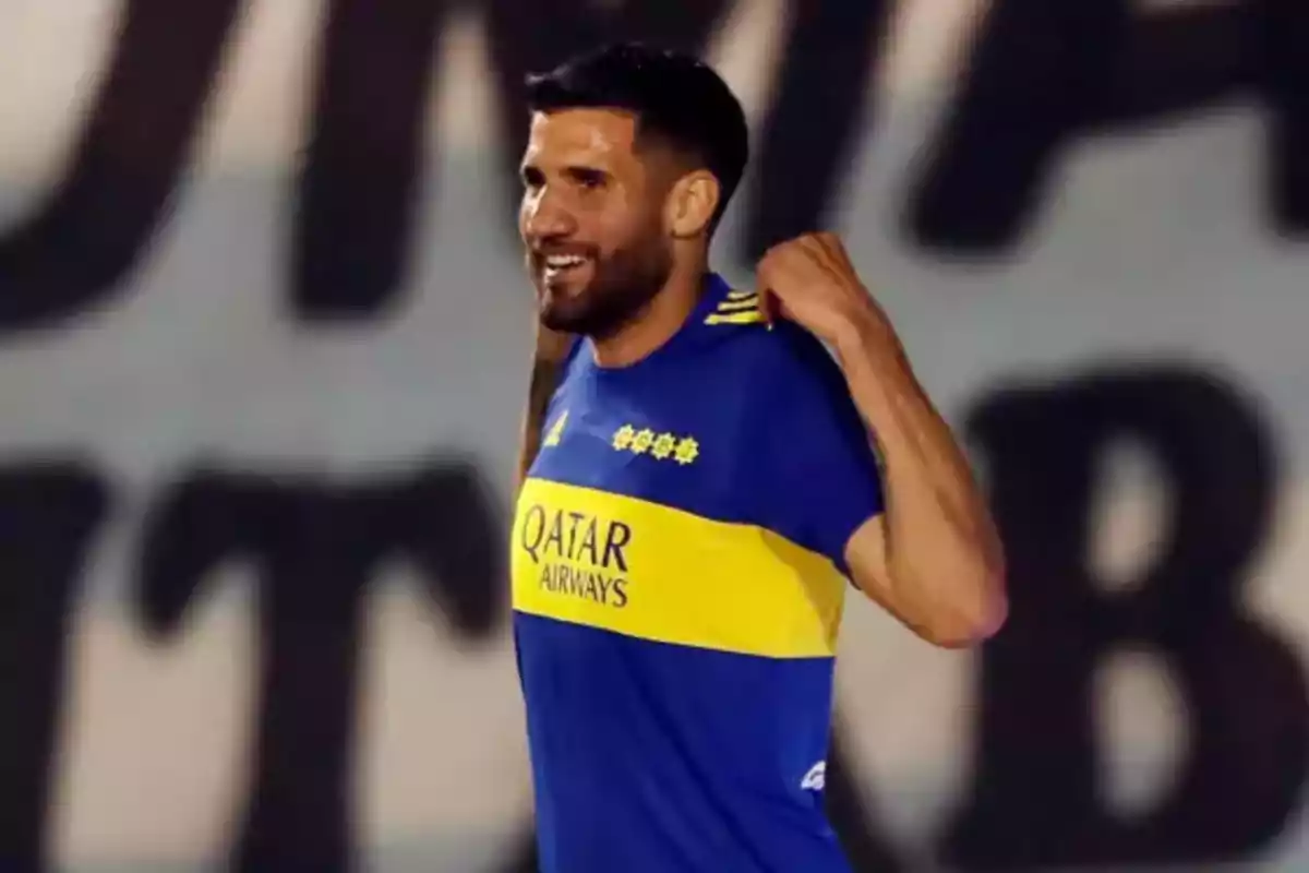 Soccer player wearing a blue and yellow jersey celebrating on the field Soccer player wearing a blue and yellow jersey celebrating on the field