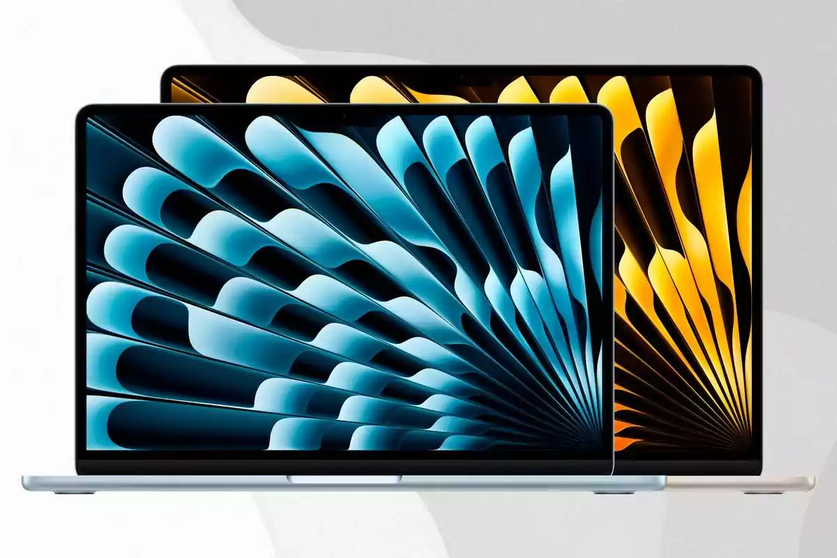 Two laptops with screens on displaying abstract backgrounds in blue and yellow tones, facing each other Two laptops with screens on displaying abstract backgrounds in blue and yellow tones, facing each other