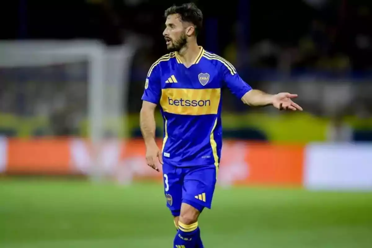 Soccer player wearing Boca Juniors’ blue and yellow uniform on the field during a match Soccer player wearing Boca Juniors’ blue and yellow uniform on the field during a match