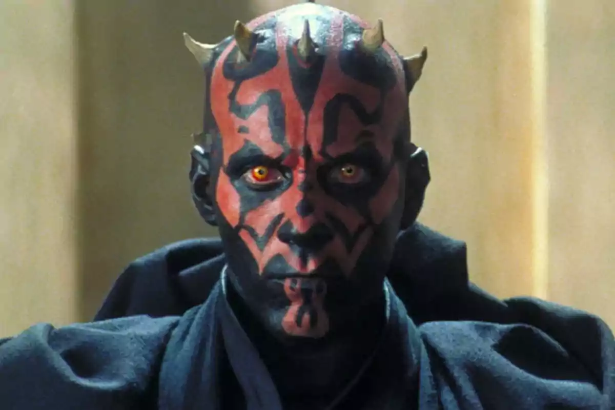 Character with a face painted red and black, intense yellow eyes, small horns on the head, wearing a dark robe Character with a face painted red and black, intense yellow eyes, small horns on the head, wearing a dark robe