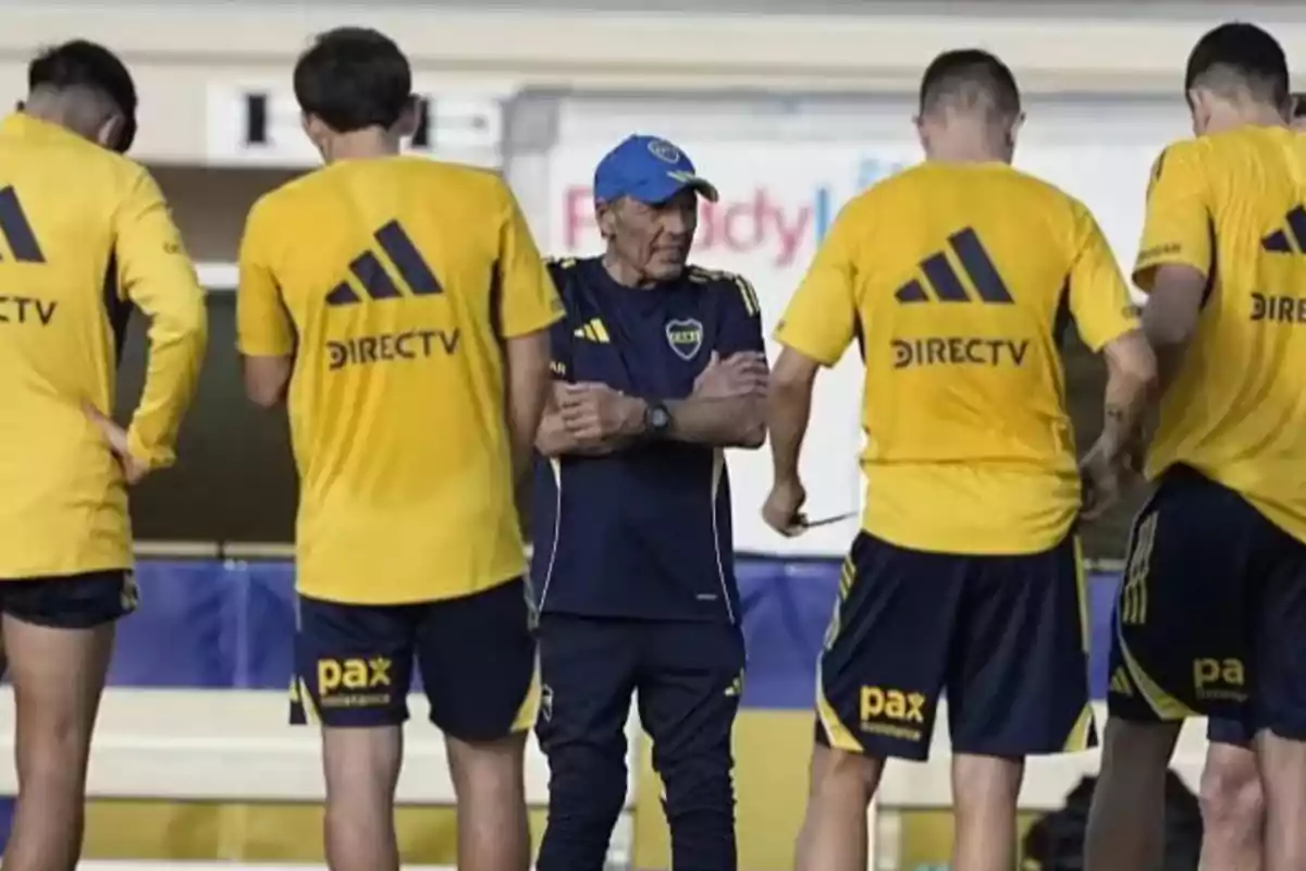 Soccer coach talking to Boca Juniors players during a practice at the training ground Soccer coach talking to Boca Juniors players during a practice at the training ground