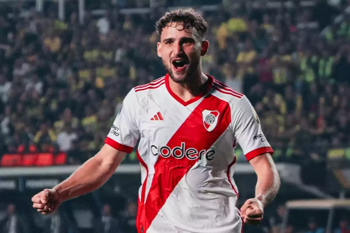 River Plate player celebrating a goal in a stadium full of fans River Plate player celebrating a goal in a stadium full of fans