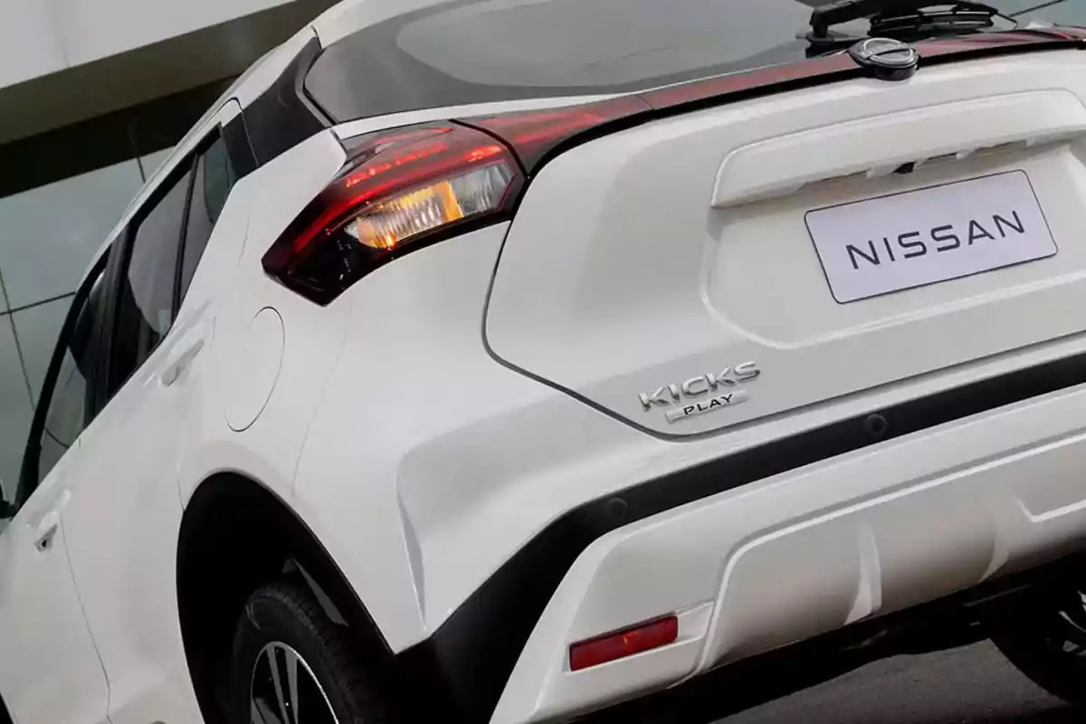 Rear view of a white Nissan Kicks parked Rear view of a white Nissan Kicks parked