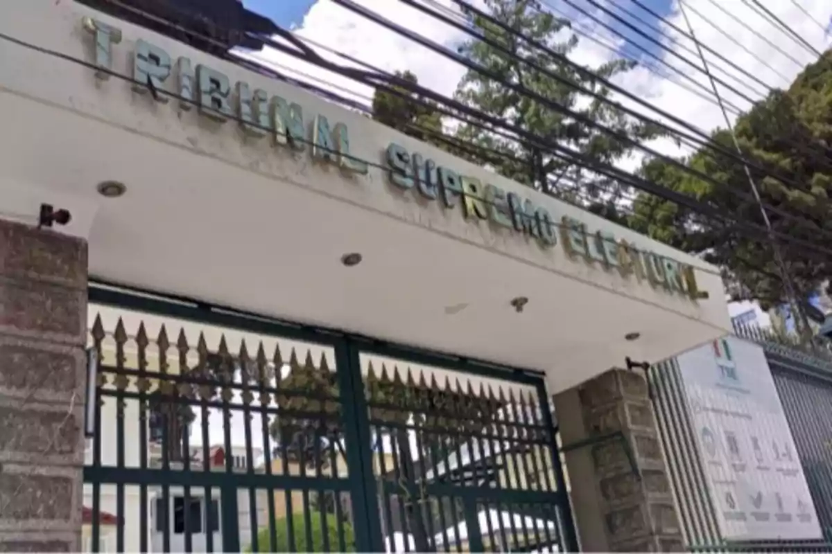 Main entrance of the Supreme Electoral Court with a barred gate and a metal sign on top Main entrance of the Supreme Electoral Court with a barred gate and a metal sign on top