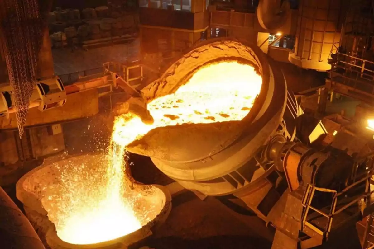 Pouring molten metal in an industrial steel mill