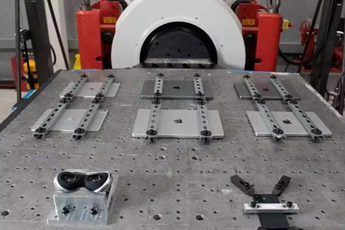Several Apple electronic devices secured to a test bench in a laboratory Several Apple electronic devices secured to a test bench in a laboratory