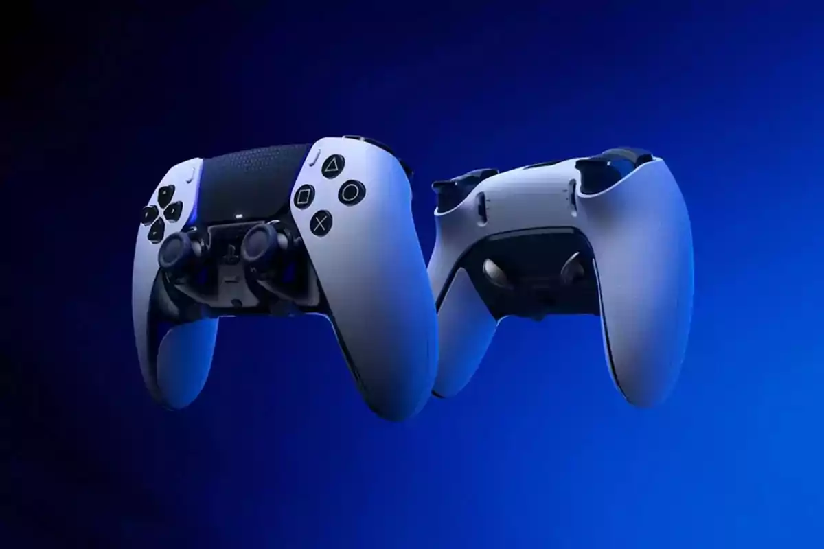 Two wireless video game controllers in white and black floating over a blue background Two wireless video game controllers in white and black floating over a blue background