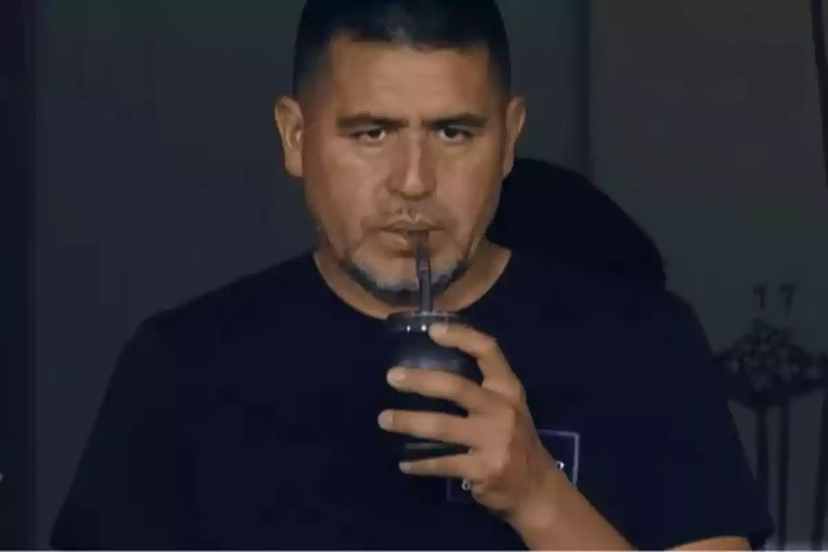 Short-haired man with a beard drinking mate with a serious expression Short-haired man with a beard drinking mate with a serious expression