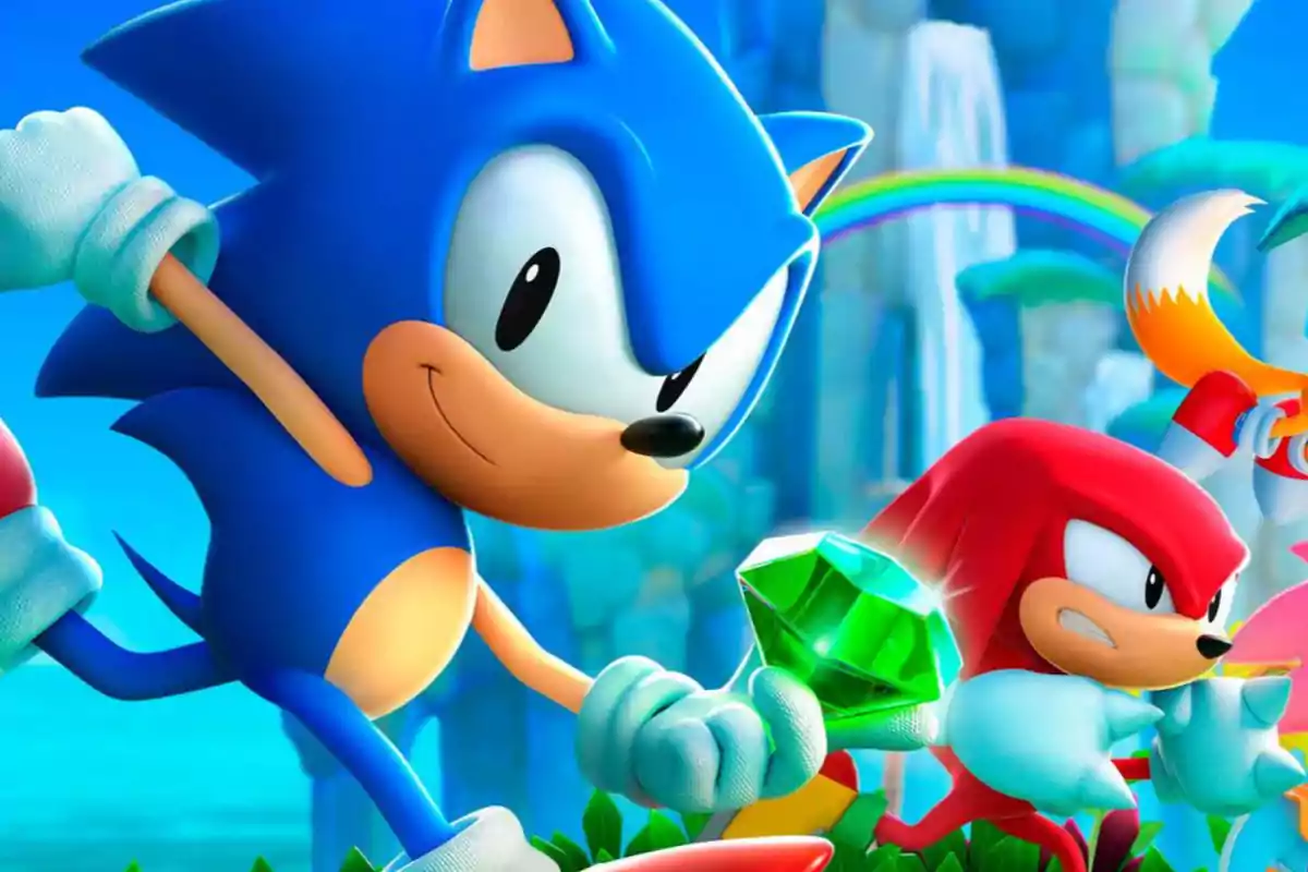 Sonic, Knuckles y Tails aparecen en un colorido escenario con un fondo de arcoíris y una esmeralda verde brillante