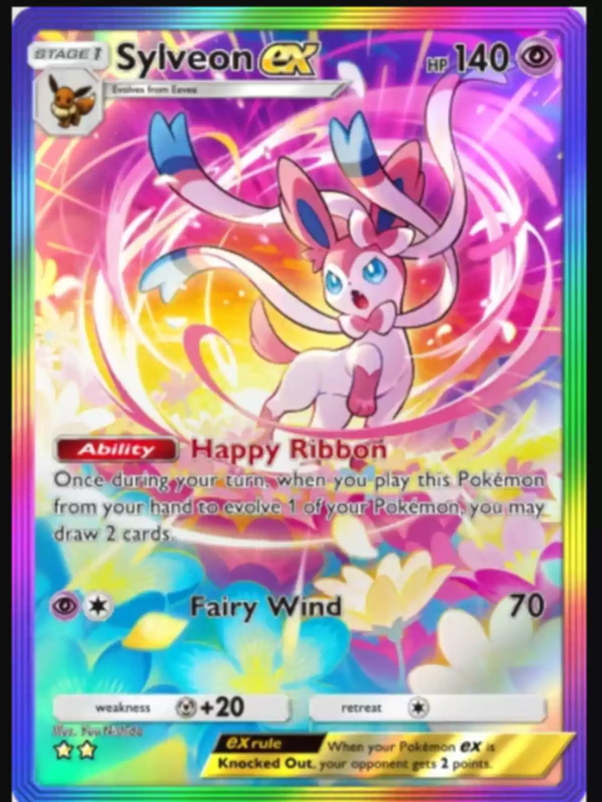 Carta Pokémon Sylveon EX con fondo colorido y detalles brillantes, mostrando a Sylveon en el centro rodeado de lazos y flores Carta Pokémon Sylveon EX con fondo colorido y detalles brillantes, mostrando a Sylveon en el centro rodeado de lazos y flores