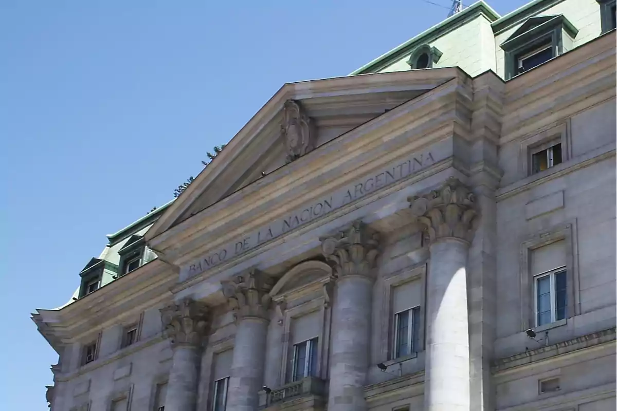 Facade of the Banco de la Nación Argentina building with columns and classical architectural details under a clear sky Facade of the Banco de la Nación Argentina building with columns and classical architectural details under a clear sky