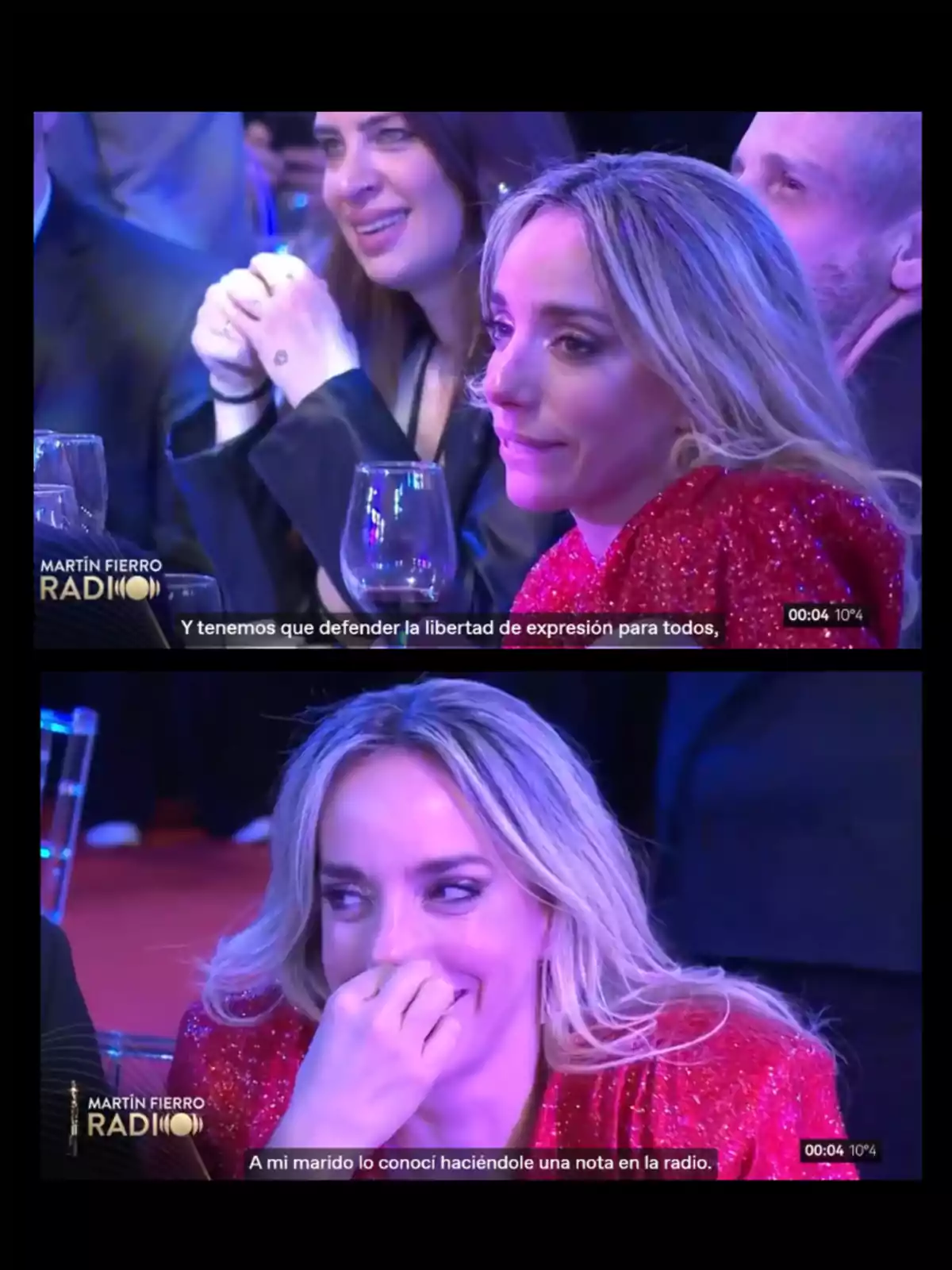 Blonde woman in a red dress sitting at an awards ceremony, first with a serious expression and then smiling while covering her mouth, accompanied by other people and glasses on the table, with subtitles at the bottom. Blonde woman in a red dress sitting at an awards ceremony, first with a serious expression and then smiling while covering her mouth, accompanied by other people and glasses on the table, with subtitles at the bottom.