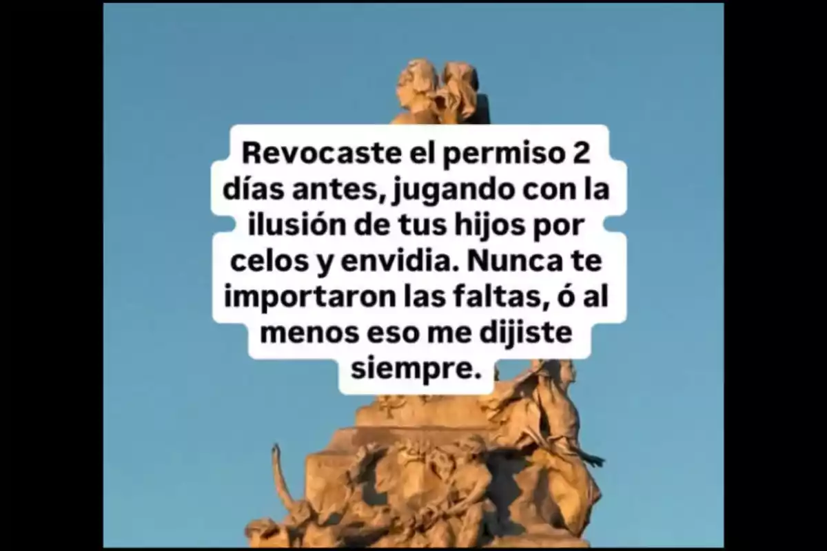Stone monument under a blue sky with text in the center expressing disappointment over the revocation of a permit and mentioning feelings of jealousy, envy, and disregard for faults. Stone monument under a blue sky with text in the center expressing disappointment over the revocation of a permit and mentioning feelings of jealousy, envy, and disregard for faults.