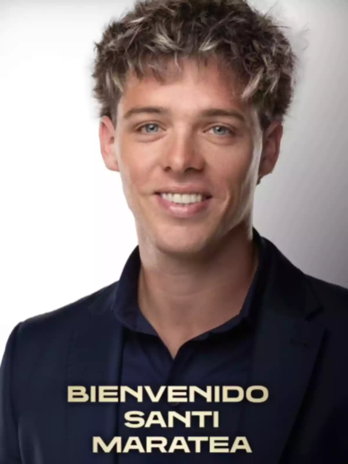 Portrait of a young man with short blond hair, wearing a dark jacket and a blue jersey, with the text Portrait of a young man with short blond hair, wearing a dark jacket and a blue jersey, with the text