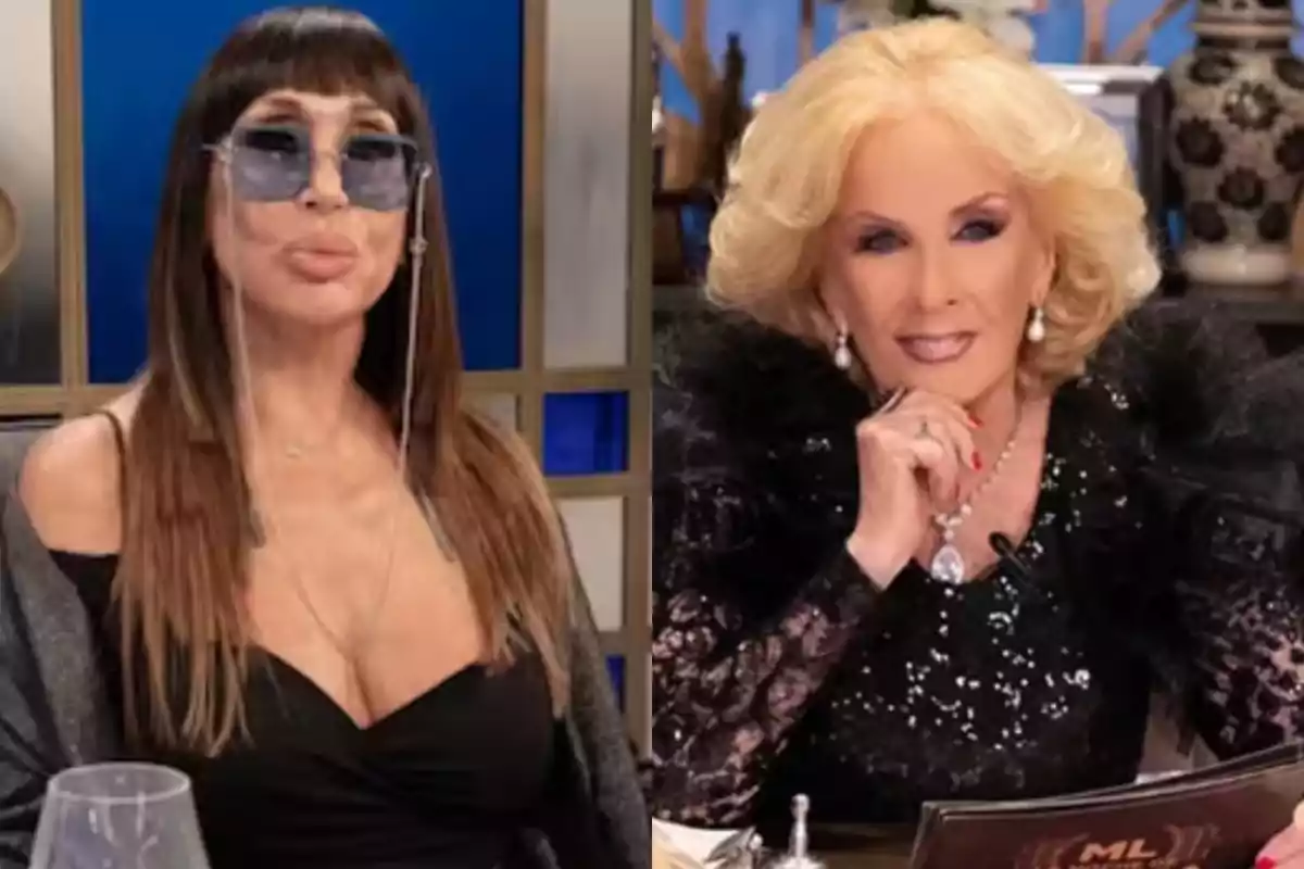 Two women sitting on a television set, one with sunglasses and long brown hair, the other with blonde hair and an elegant black dress