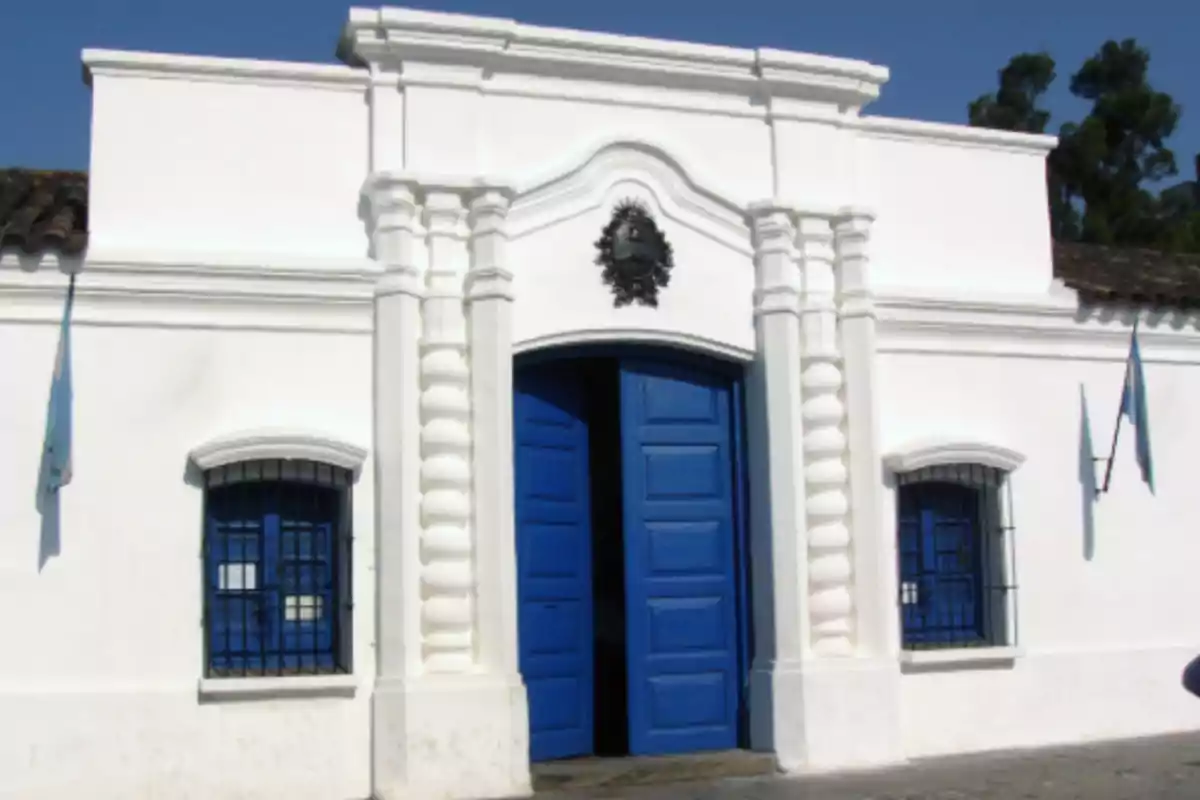 Facade of the Historic House of Tucumán with blue doors and windows under a clear sky