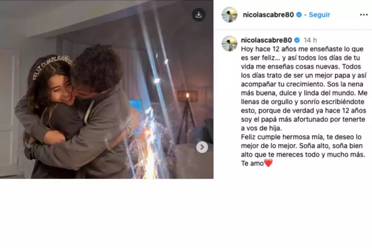A man hugs and kisses a smiling girl who is wearing a headband that says A man hugs and kisses a smiling girl who is wearing a headband that says