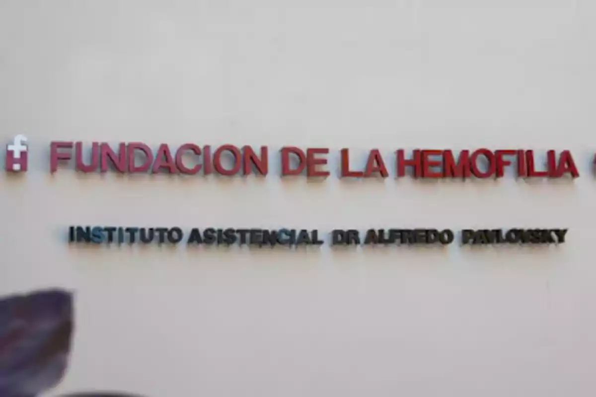 Sign on a wall that says Hemophilia Foundation Dr. Alfredo Pavlovsky Care Institute