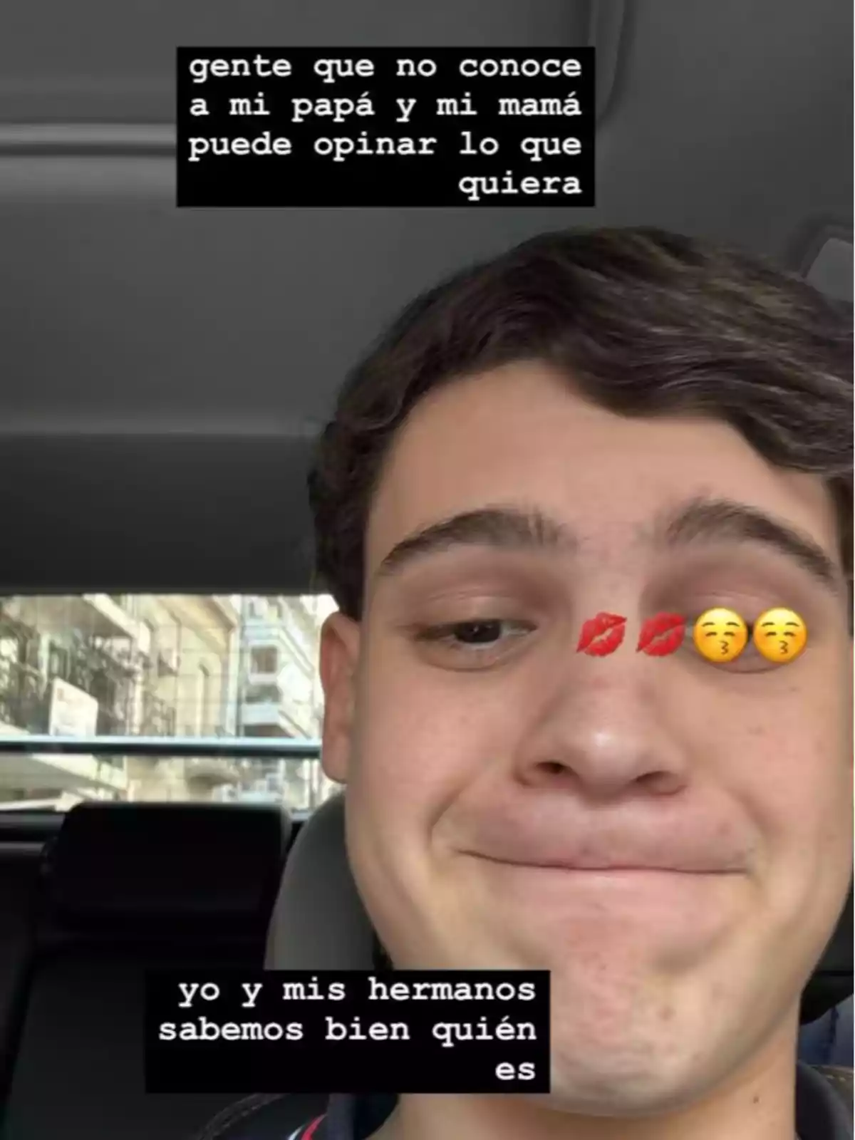 Young man sitting in the back seat of a car with a satisfied expression, with kiss and thinking face emojis over his face, and the image features texts about other people's opinions on his parents and how he and his siblings do know who they are. Young man sitting in the back seat of a car with a satisfied expression, with kiss and thinking face emojis over his face, and the image features texts about other people's opinions on his parents and how he and his siblings do know who they are.