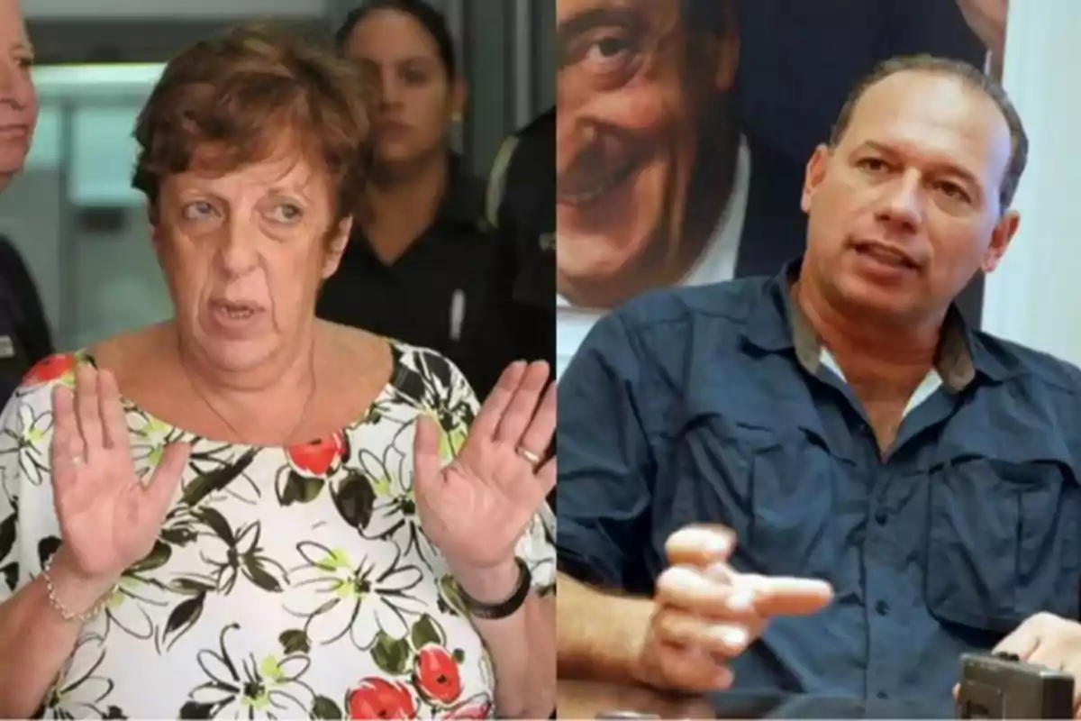 Una mujer de cabello corto y canoso con una blusa floreada levanta las manos mientras un hombre de cabello corto y camisa azul está sentado gesticulando con las manos Una mujer de cabello corto y canoso con una blusa floreada levanta las manos mientras un hombre de cabello corto y camisa azul está sentado gesticulando con las manos