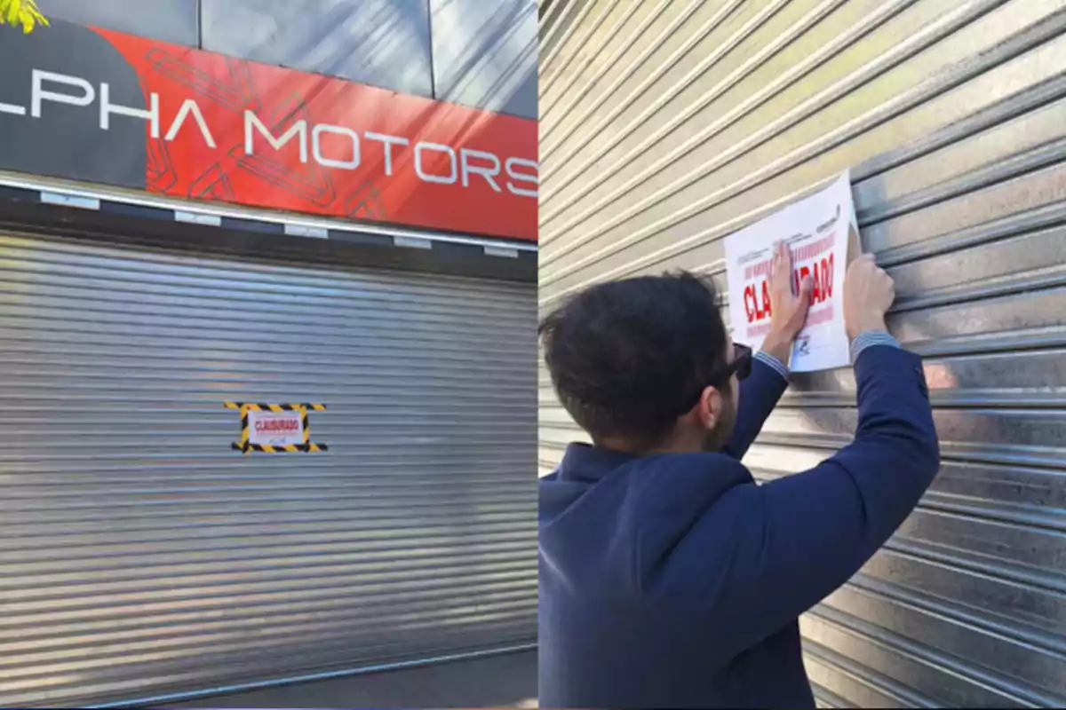 Person putting a "closed" sign on the metal shutter of a store called Alpha Motors