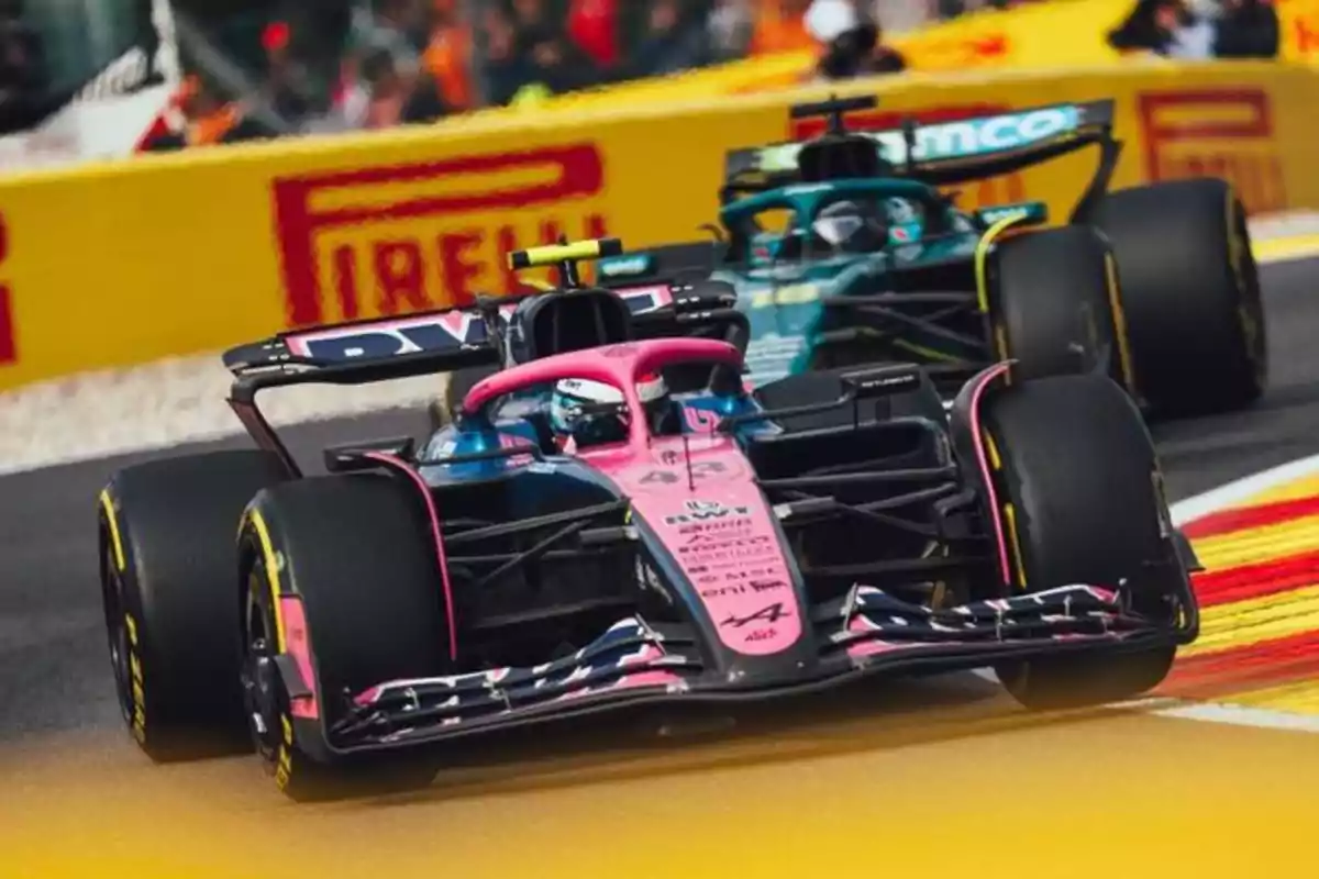 Two Formula 1 cars racing on a track with Pirelli advertising in the background