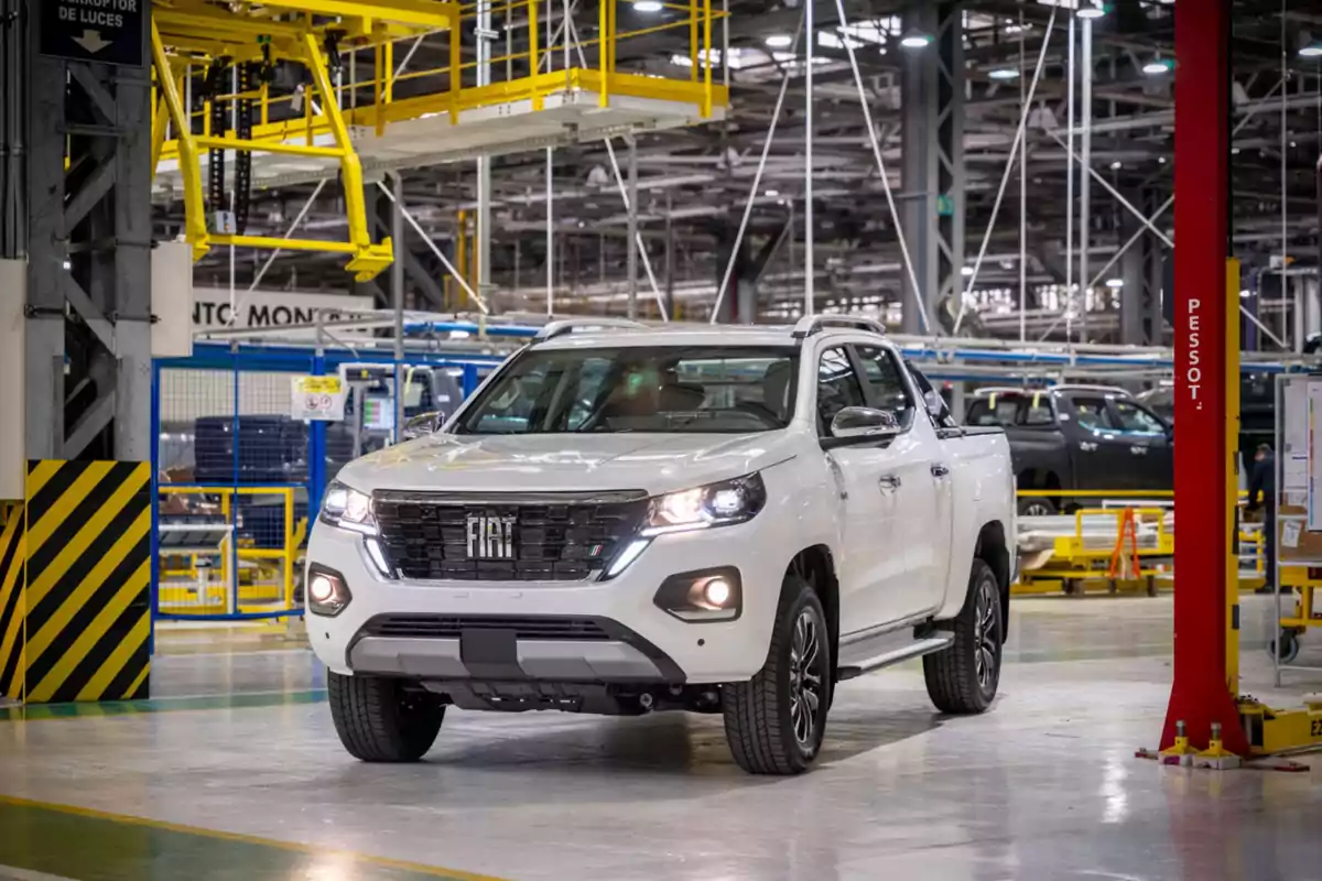 White Fiat pickup truck inside an automotive assembly plant White Fiat pickup truck inside an automotive assembly plant