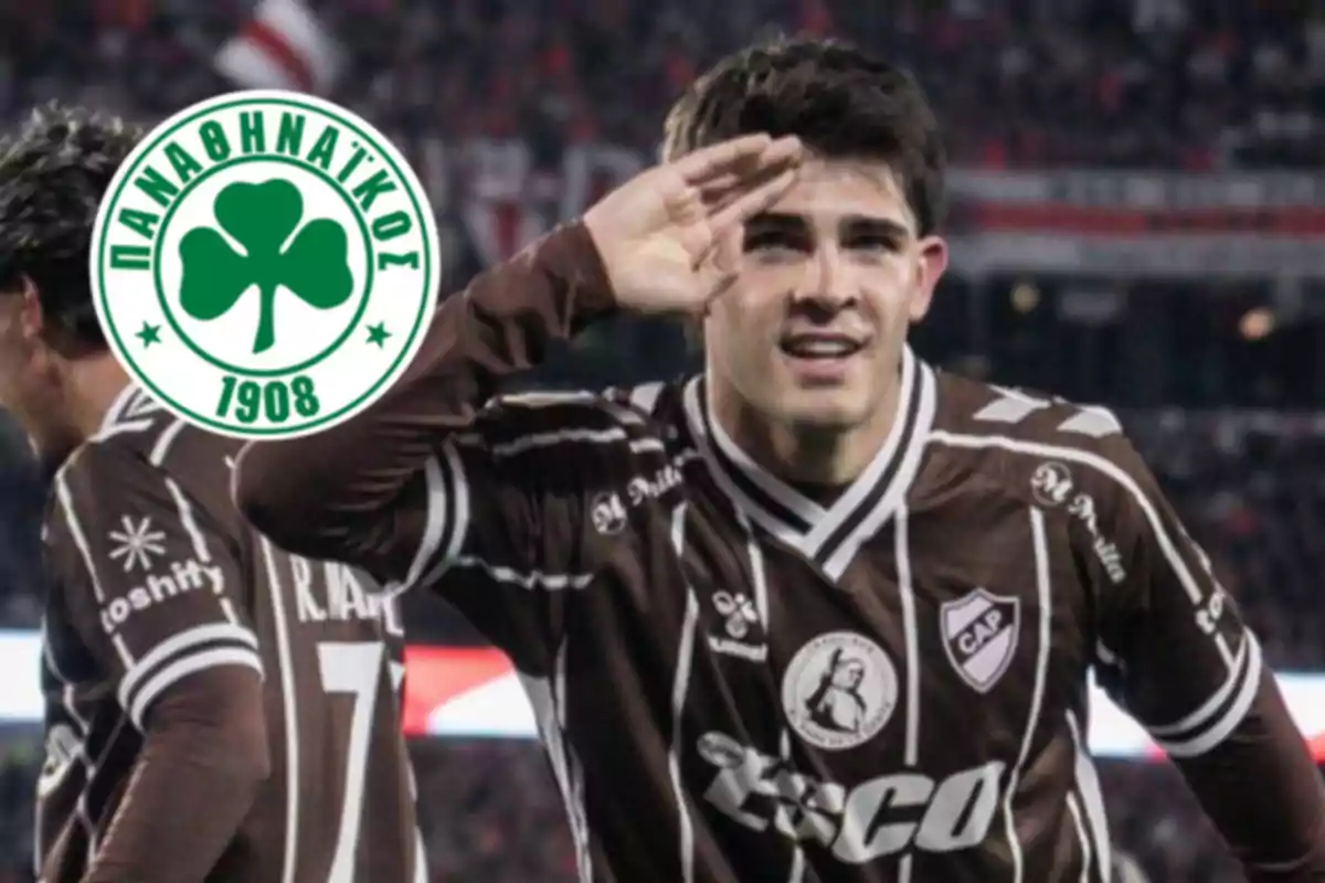Soccer player in a brown uniform celebrating a goal with a military salute and the Panathinaikos club crest in the background