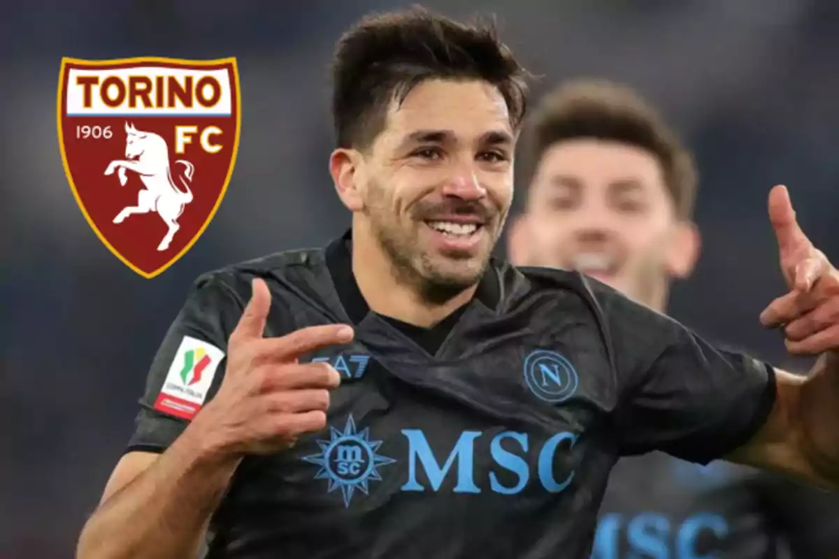 Soccer player celebrating a goal wearing the Napoli jersey with the Torino FC crest in the background