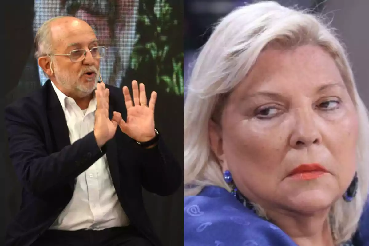 An older man with glasses and a beard gestures with his hands while a blonde woman watches him with a serious expression. An older man with glasses and a beard gestures with his hands while a blonde woman watches him with a serious expression.