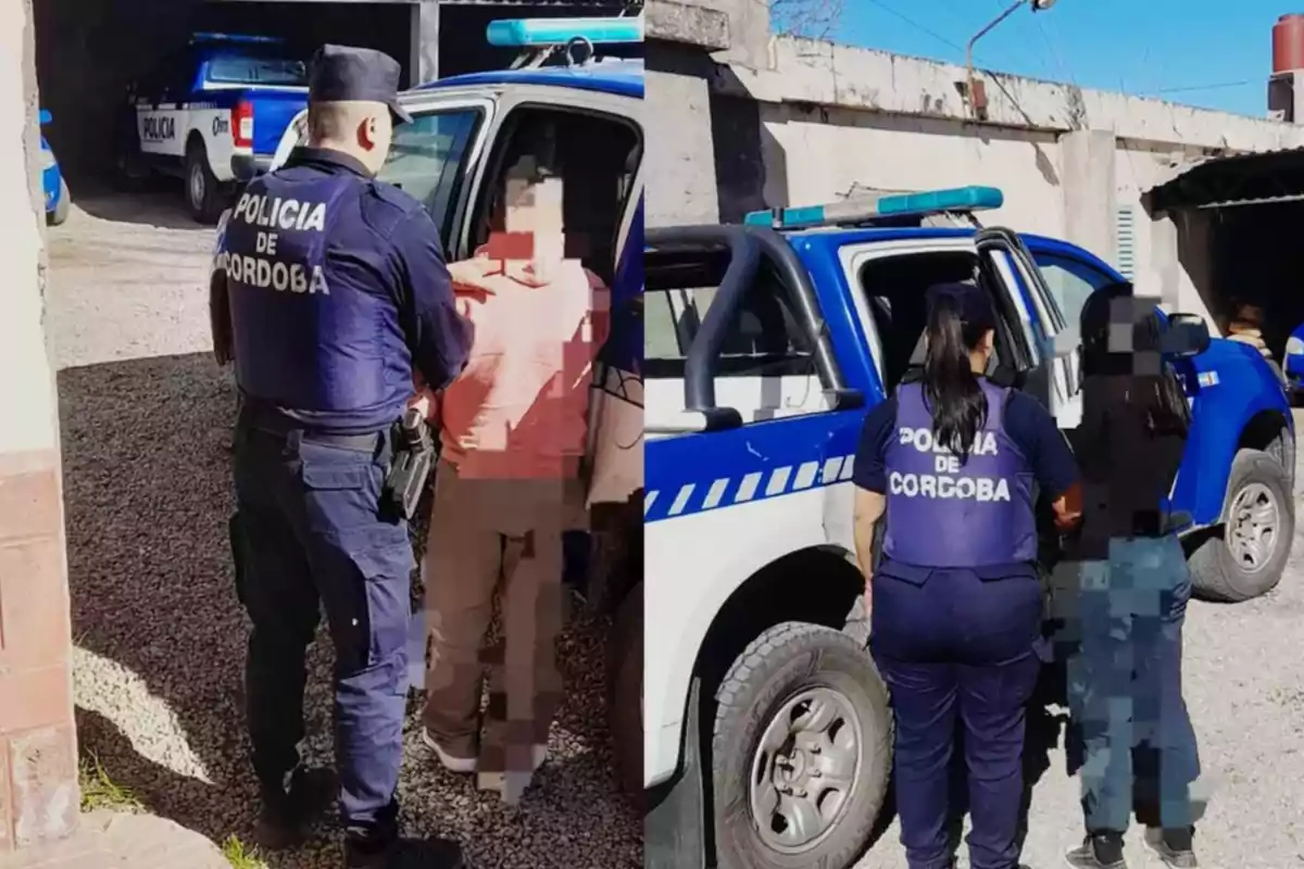 Two Córdoba police officers escort two people to a police truck in a yard with other official vehicles in the background.