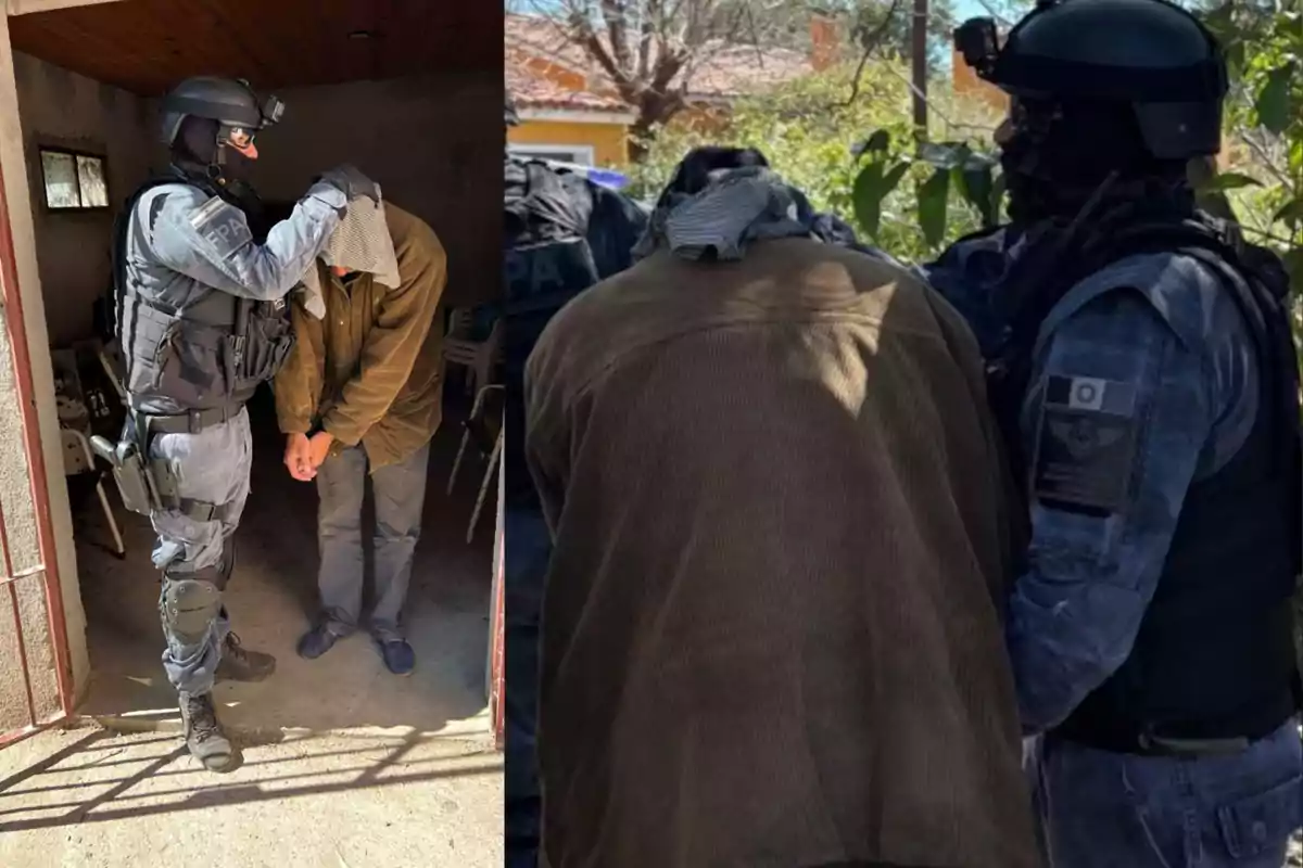A police officer in tactical uniform detains a handcuffed person whose head is covered with a garment; they are in different locations, one inside a residence and the other outside.