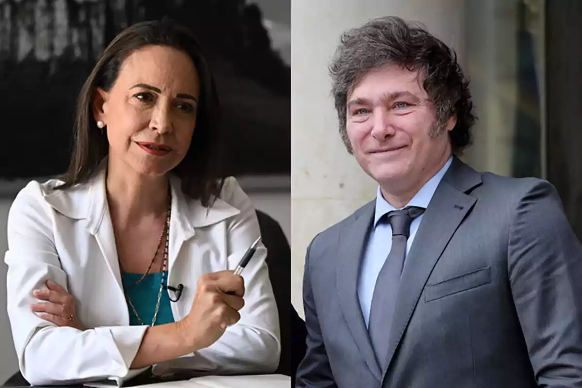 A dark-haired woman dressed in a white blazer holds a pen while a curly-haired man in a gray suit smiles.