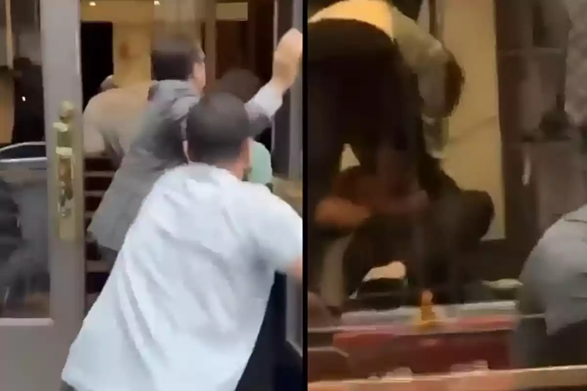 Several people struggle and fight inside a building while others try to get in through the door.