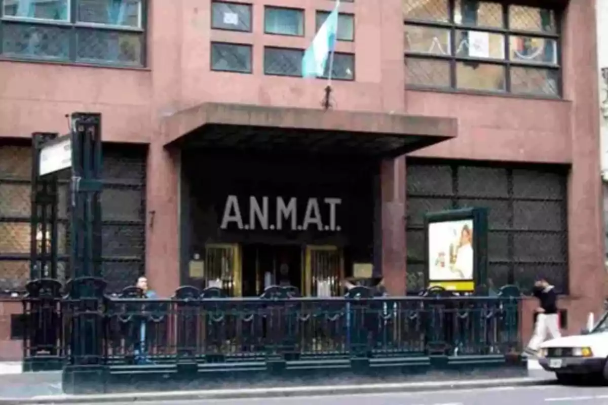 Facade of the ANMAT building in Buenos Aires with an Argentine flag waving at the top Facade of the ANMAT building in Buenos Aires with an Argentine flag waving at the top
