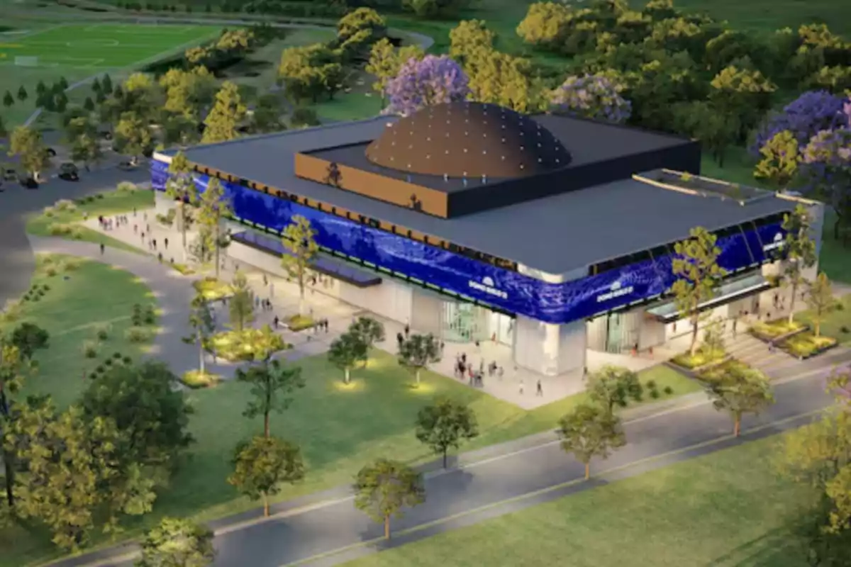 Modern building with a central dome surrounded by green areas and pedestrian paths, with people walking around and trees in the surroundings Modern building with a central dome surrounded by green areas and pedestrian paths, with people walking around and trees in the surroundings