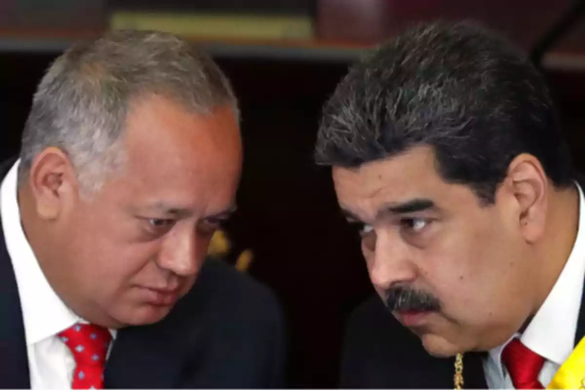 Two men in suits talk in a serious and intimate tone. Two men in suits talk in a serious and intimate tone.