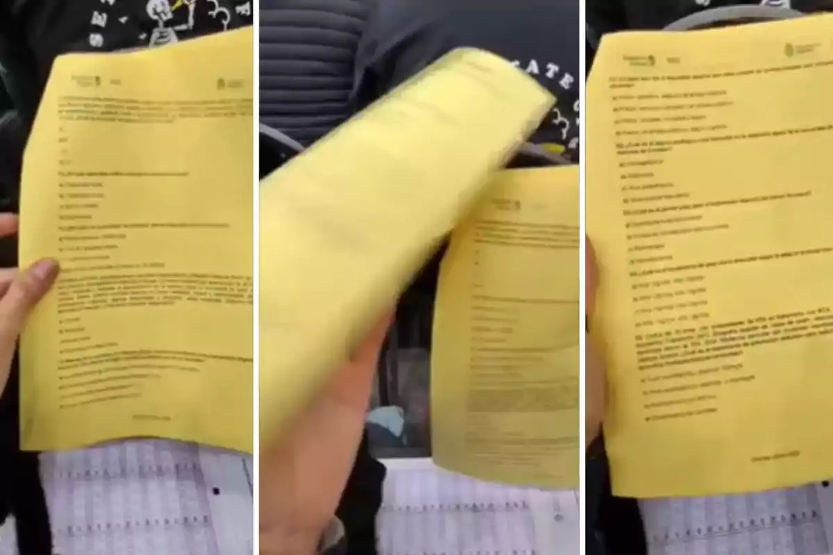 Person holding and flipping through a printed exam on yellow sheets Person holding and flipping through a printed exam on yellow sheets