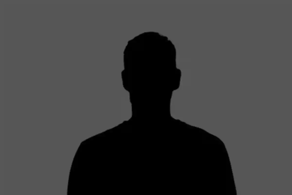 Black silhouette of a person against a gray background