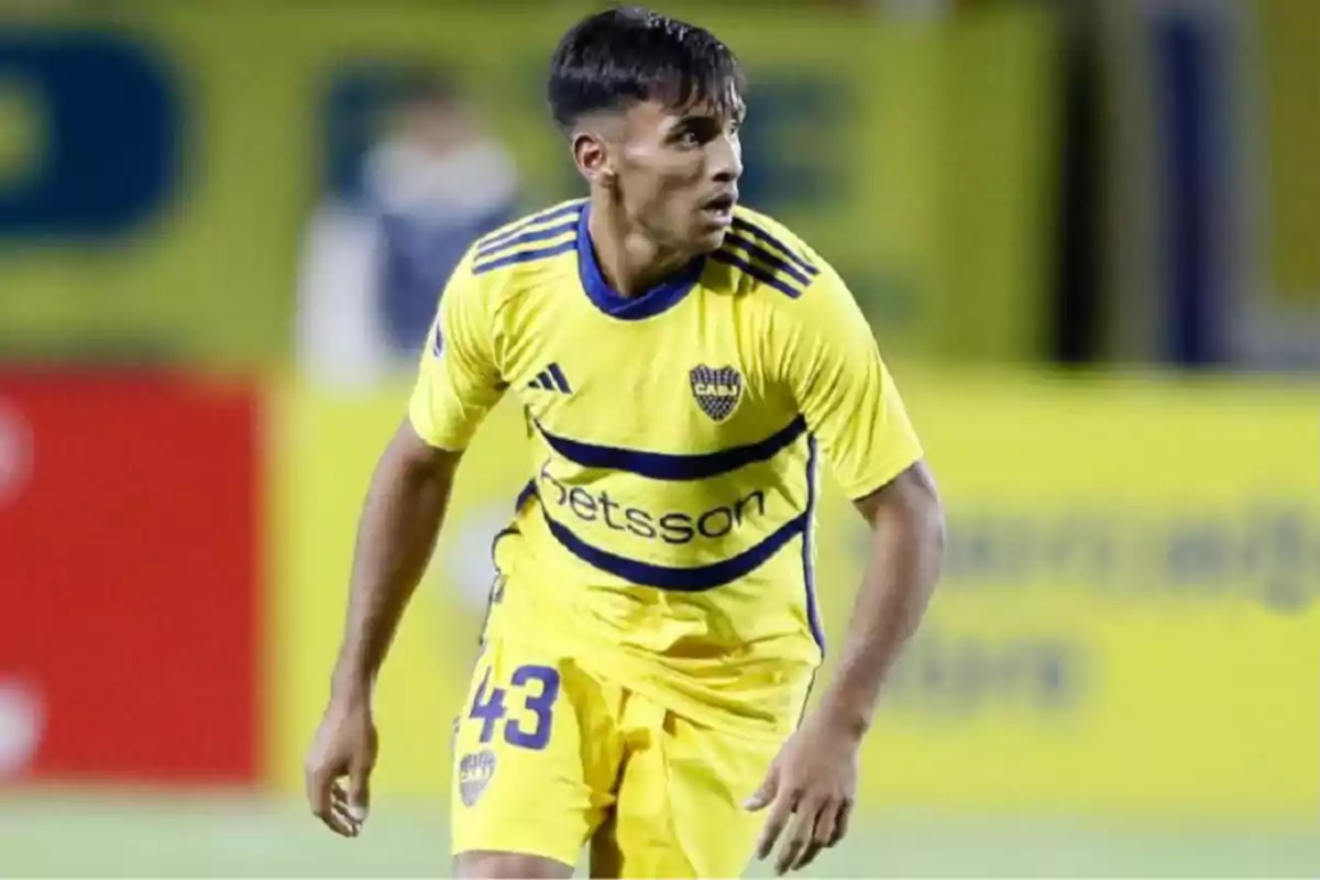 Soccer player wearing Boca Juniors’ yellow uniform on the field during a match Soccer player wearing Boca Juniors’ yellow uniform on the field during a match
