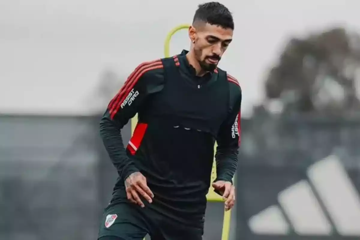 Soccer player training in River Plate gear on an outdoor field Soccer player training in River Plate gear on an outdoor field