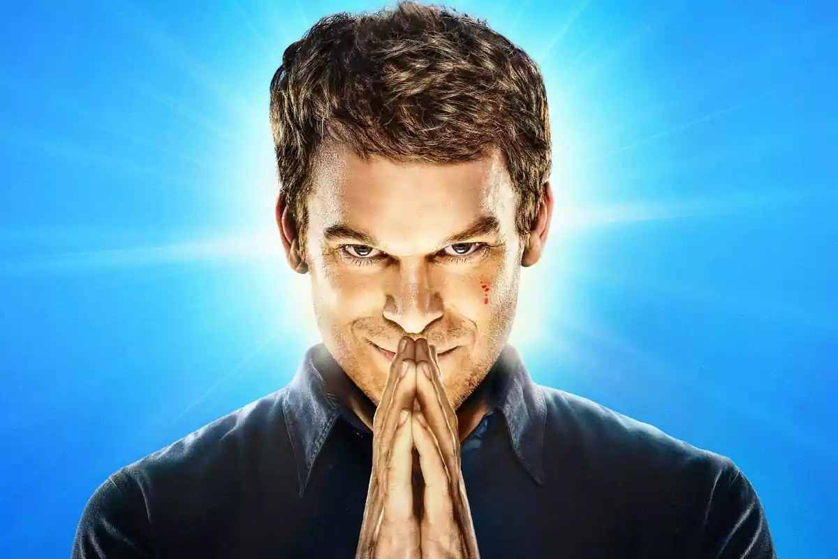 Man with a mysterious expression and hands together in front of a bright blue background Man with a mysterious expression and hands together in front of a bright blue background