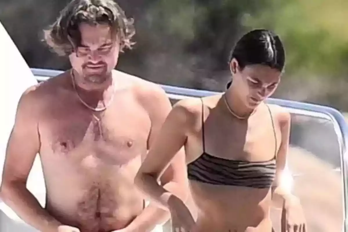 Two people in swimsuits walking outdoors on a sunny day Two people in swimsuits walking outdoors on a sunny day