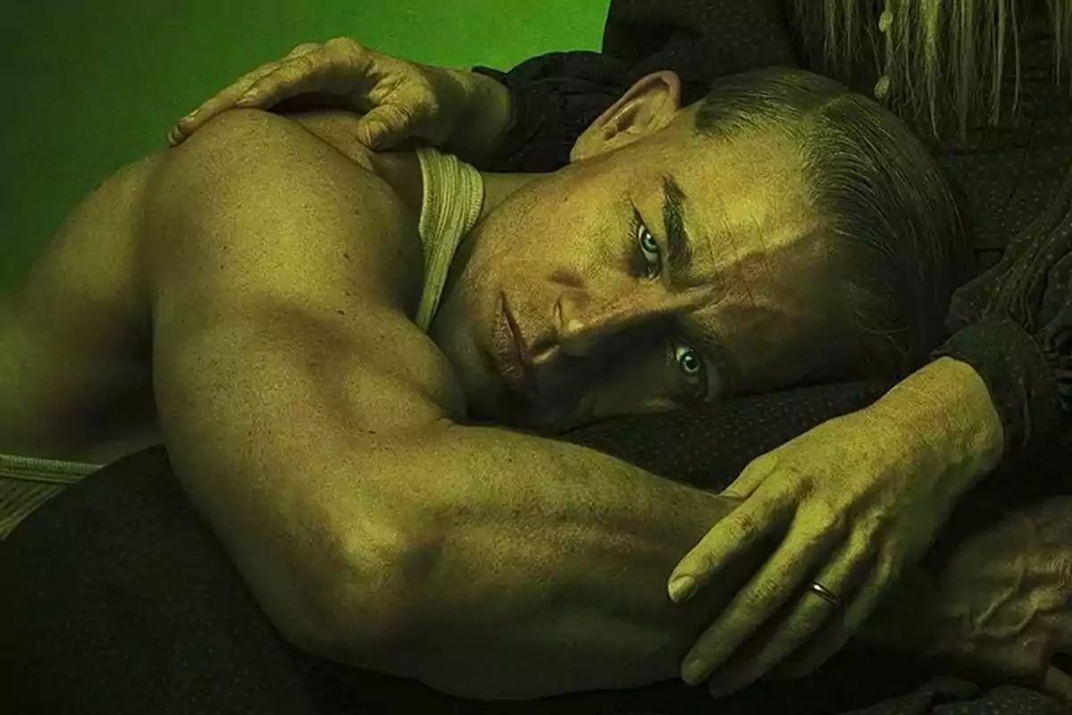 Muscular man lying down with a serious expression while an older person hugs him against a green background Muscular man lying down with a serious expression while an older person hugs him against a green background
