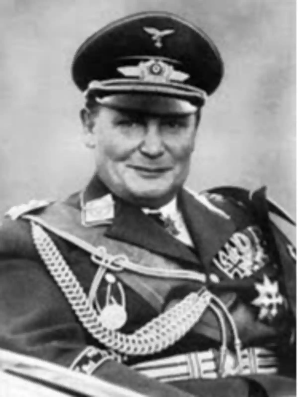 Black and white portrait of a military officer in uniform and cap, with visible insignias and medals. Black and white portrait of a military officer in uniform and cap, with visible insignias and medals.