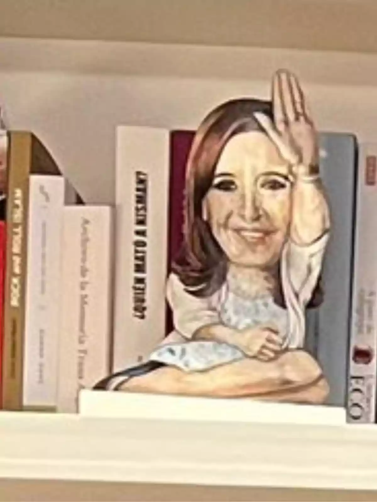 Figure of a seated woman with her raised hand placed among books on a shelf Figure of a seated woman with her raised hand placed among books on a shelf