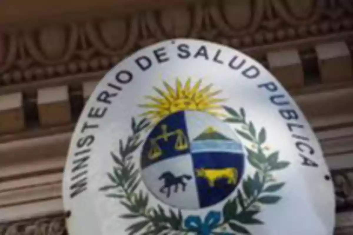 National coat of arms of Uruguay on a Ministry of Public Health sign on the wall of an old building National coat of arms of Uruguay on a Ministry of Public Health sign on the wall of an old building