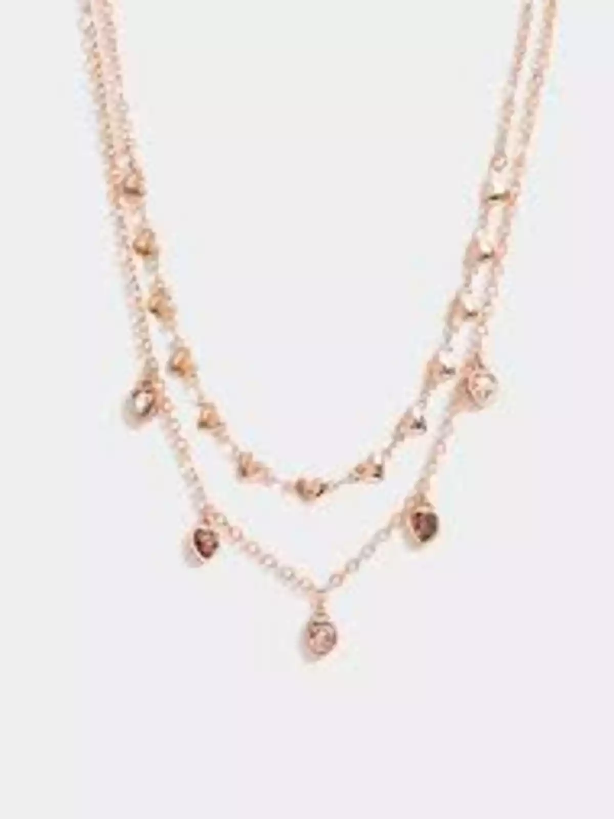Double gold chain necklace with small heart-shaped charms and sparkling stones Double gold chain necklace with small heart-shaped charms and sparkling stones